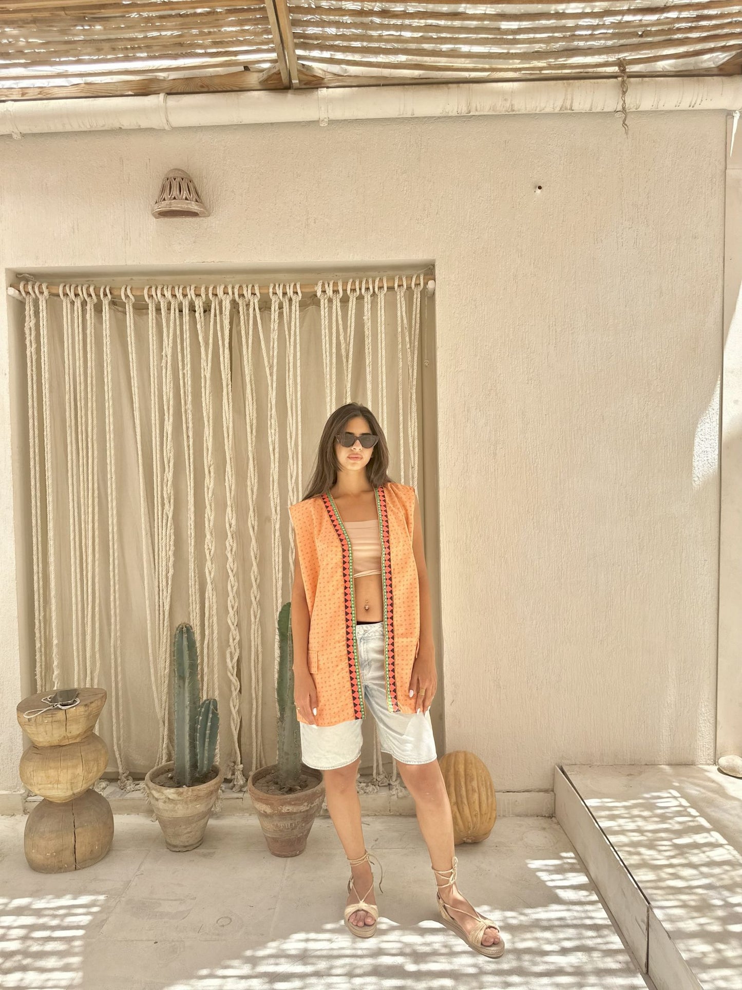 orange vest with indian fabrics