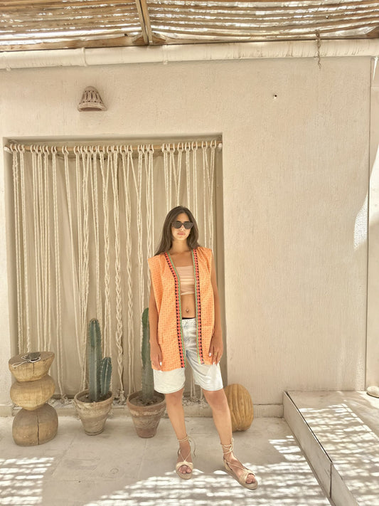 orange vest with indian fabrics